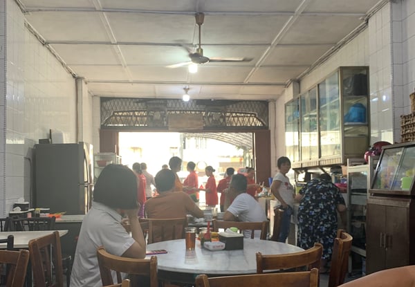 Image shows a humble coffee shop selling duck noodle soup in Medan
