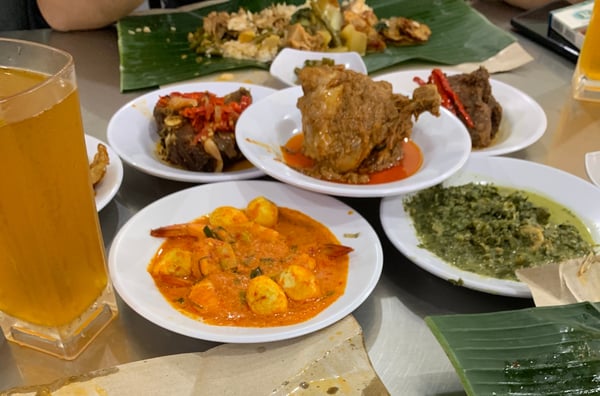 Image shows a variety of traditional indonesian dishes