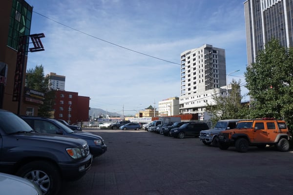 Image of a parking lot with cars 