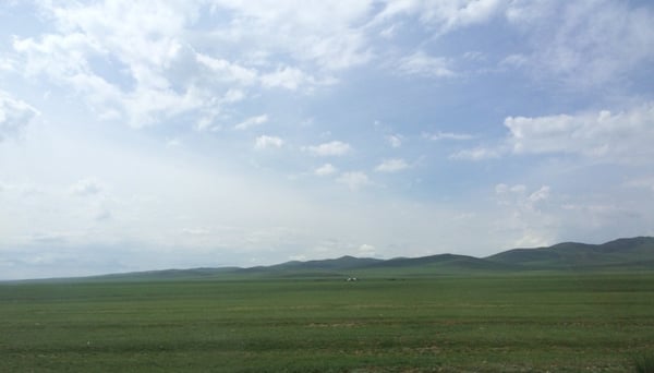 Image showing a view of vast green land and clear blue sky
