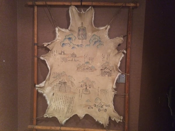 Image of an animal skin with drawings on it