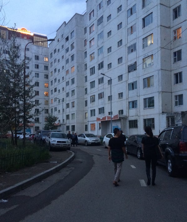 Image shows the street view of apartment blocks in the city of Ulaanbaatar