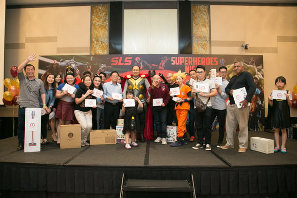 Image shows a group photo of prize winners on stage