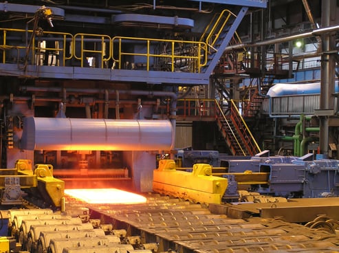 Image shows a factory in metal production