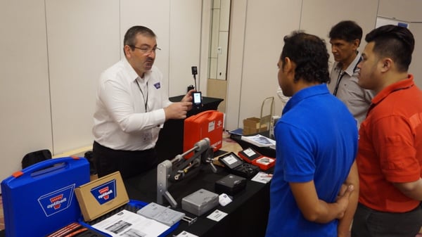 Image shows Optibelt Asia Pacific Managing Director, Mr. Maurice Sartario introducing the Optibelt TT frequency tenstion tester to customers