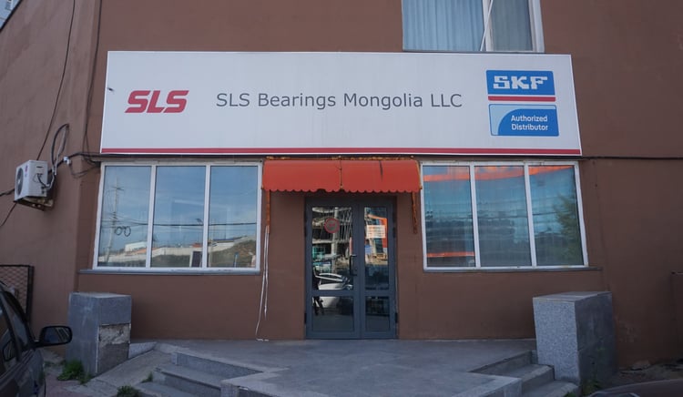 Image shows an office front with a  signboard that says SLS Bearings Mongolia LLC