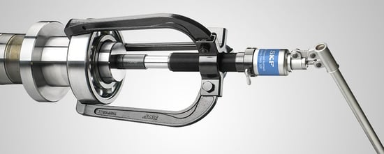 Image shows  the dismounting of  bearings using a hydraulic assisted tool